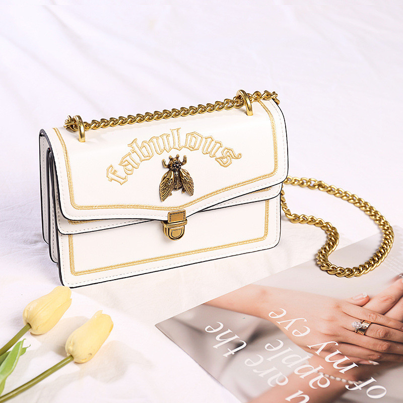 handbag with bee clasp